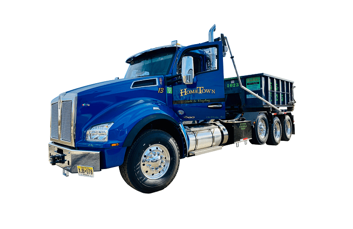 a hometown waste truck delivering a 10 yard dumpster