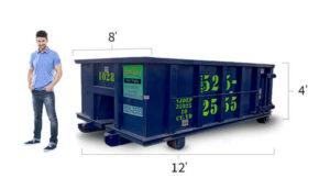 a man standing next to a 10 yard dumpster